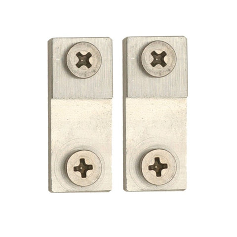Two metallic square blocks with circular holes and star-shaped center designs on a white background