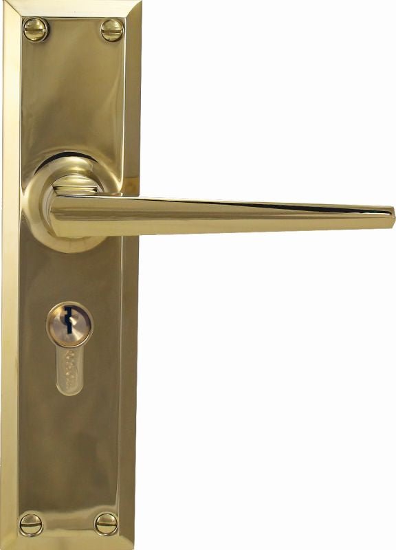 Gold door handle with lock on a white background