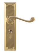 Brass door handle with lock on a white background