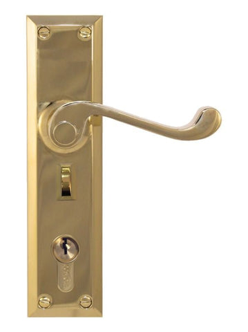 Gold door handle with lock on a white background