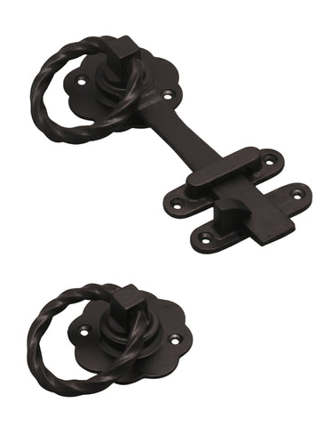 Pair of black metal door latches on a white background