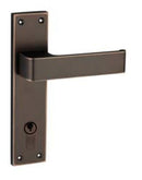 Bronze door handle with keyhole on a white background