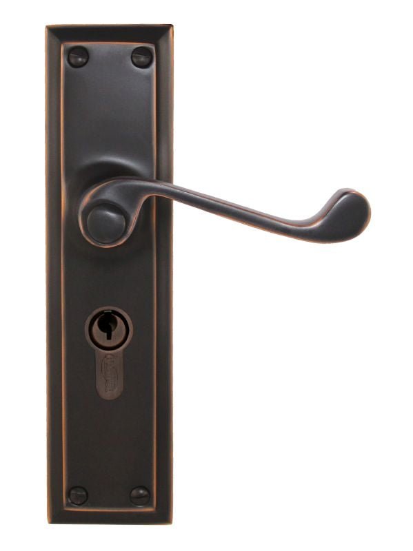 Bronze door handle with lock on a white background