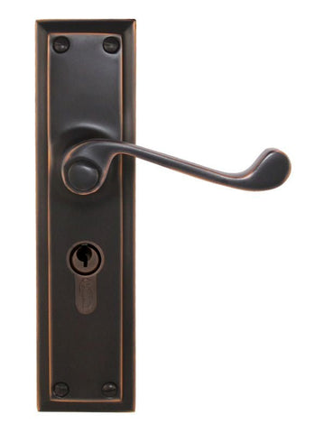 Bronze door handle with lock on a white background