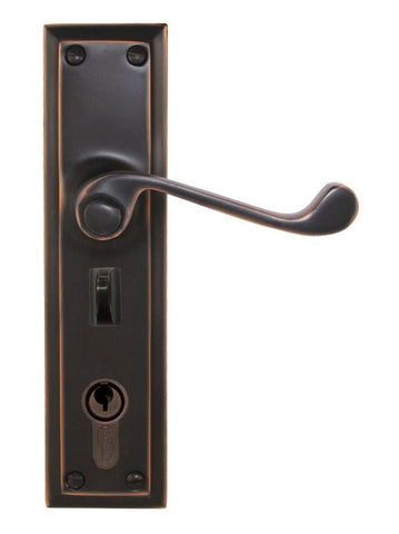 Bronze door handle with lock mechanism on a white background