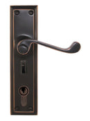 Bronze door handle with lock mechanism on a white background
