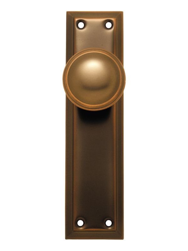 Bronze door handle with rectangular plate on a white background