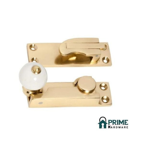 TRADCO 1604PB SASH FASTENER PORCELAIN BALL POLISHED BRASS - primehardware