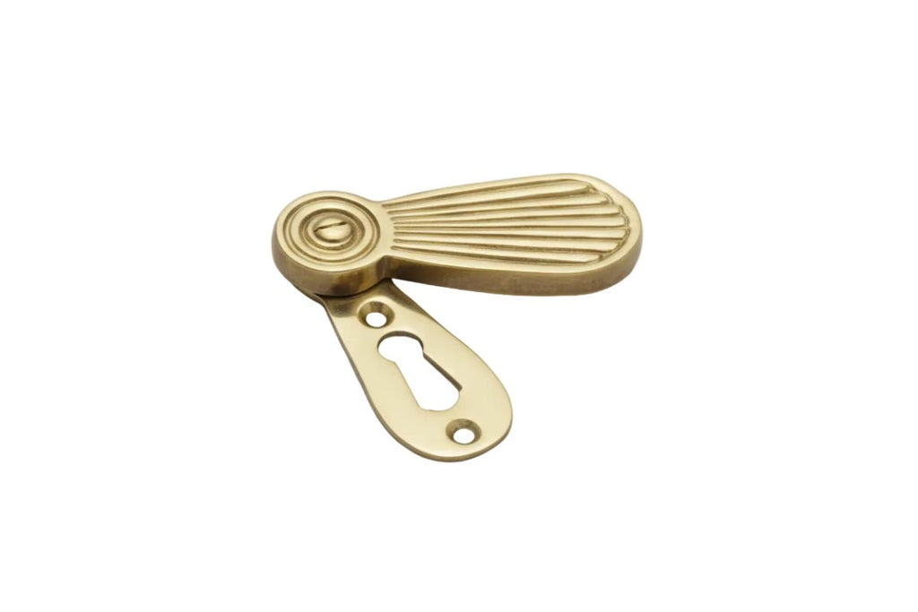 Brass window handle on a white background