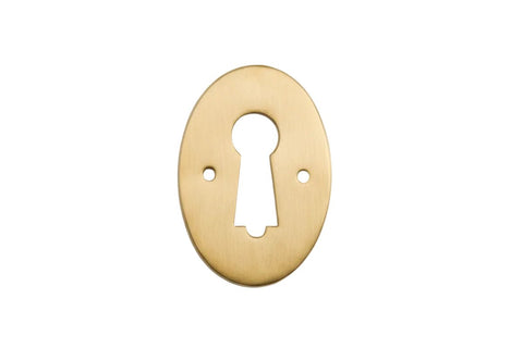Gold keyhole cover on a white background