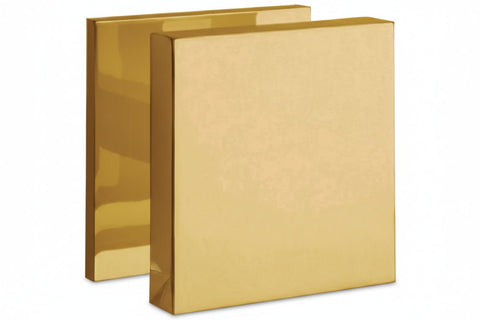 Two gold-colored books with a textured cover on a white background