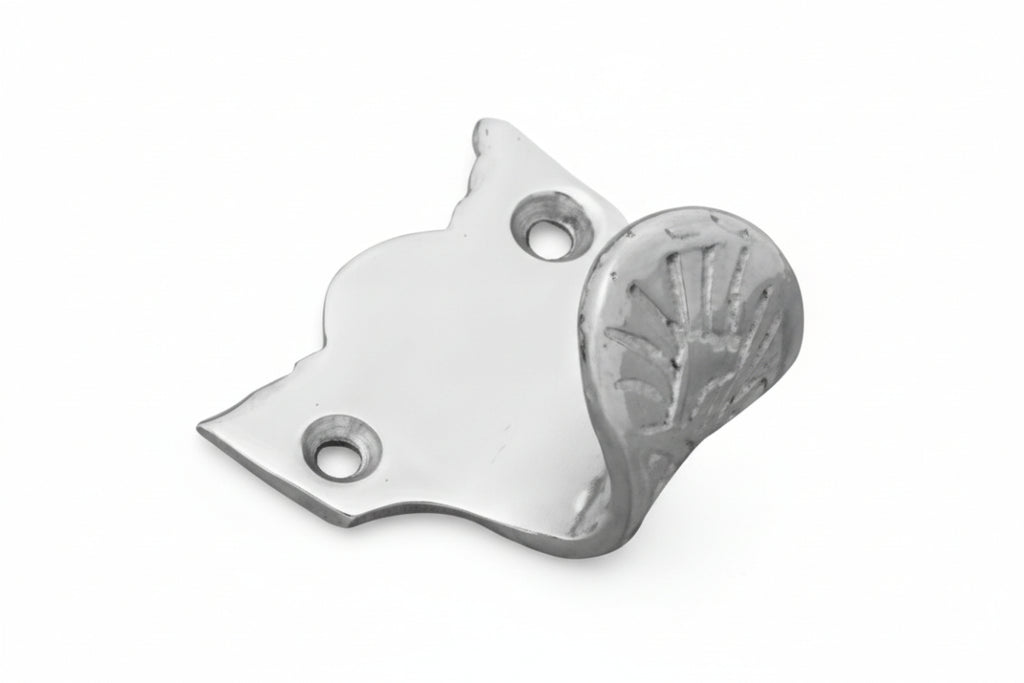 Metallic cat-shaped bottle opener on a white background