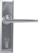Metal door handle with lock on a white background