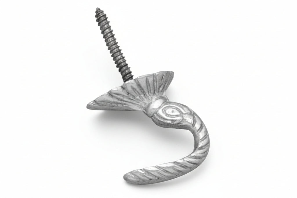 Decorative metal hook with a screw on a white background