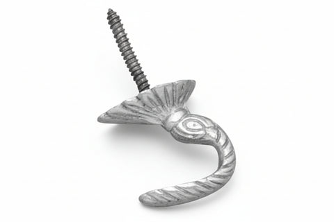 Decorative metal hook with a screw on a white background
