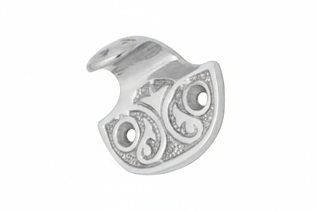 Silver pendant with intricate design on a white background