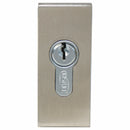 Metal door lock with keyhole on a white background