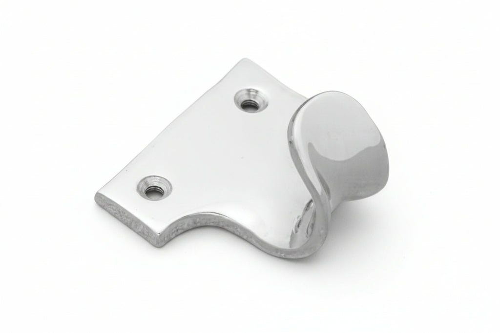 Metallic lever or handle on a white background