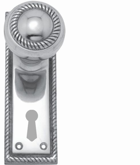 Decorative silver door handle with keyhole on a white background