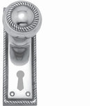 Decorative silver door handle with keyhole on a white background