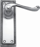 Metal door handle with decorative plate on a white background