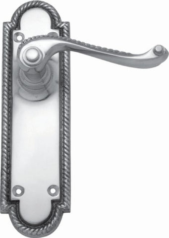 Decorative door handle with metallic finish on a white background