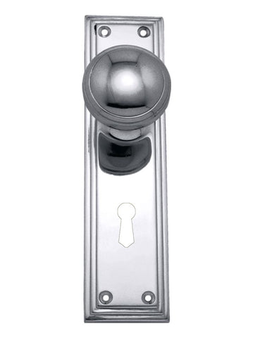 Metal door handle with keyhole on a white background