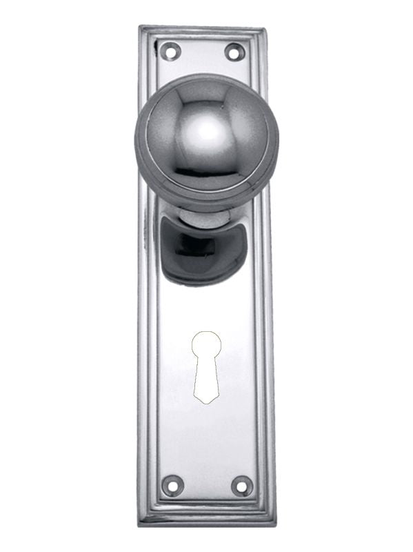 Metal door handle with keyhole on a white background
