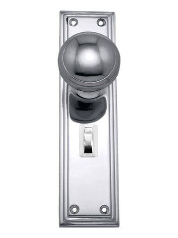 Chrome door handle with a rectangular plate on a white background