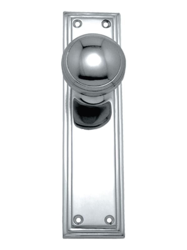 Polished chrome door handle on a white background