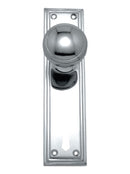 Polished chrome door handle on a white background