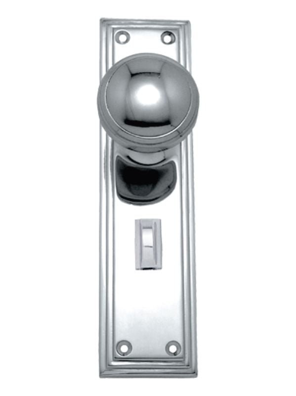 Polished chrome door handle and lock set on a white background