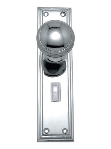 Polished chrome door handle and lock set on a white background