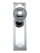 Polished chrome door handle on a white background