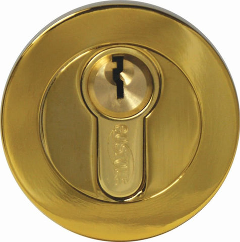 Gold cylindrical door lock on a white background