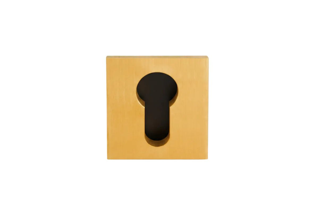 Wooden square with a black keyhole cutout on a gray background