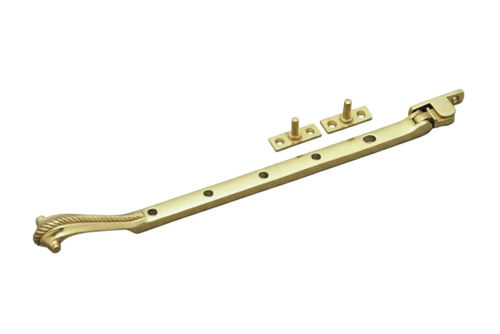 Brass window handle with decorative elements on a white background