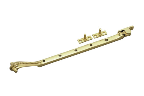 Brass window handle with decorative elements on a white background