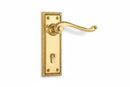 Gold door handle on a white background