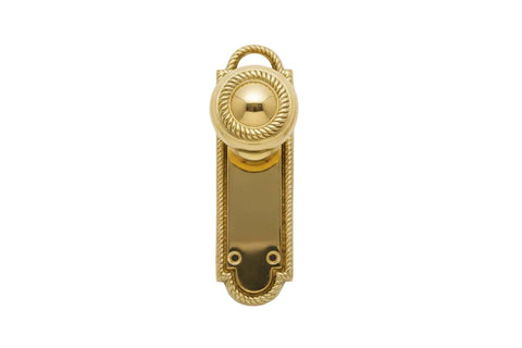 Gold door handle on a white background