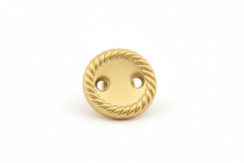 Gold button with rope pattern on a white background