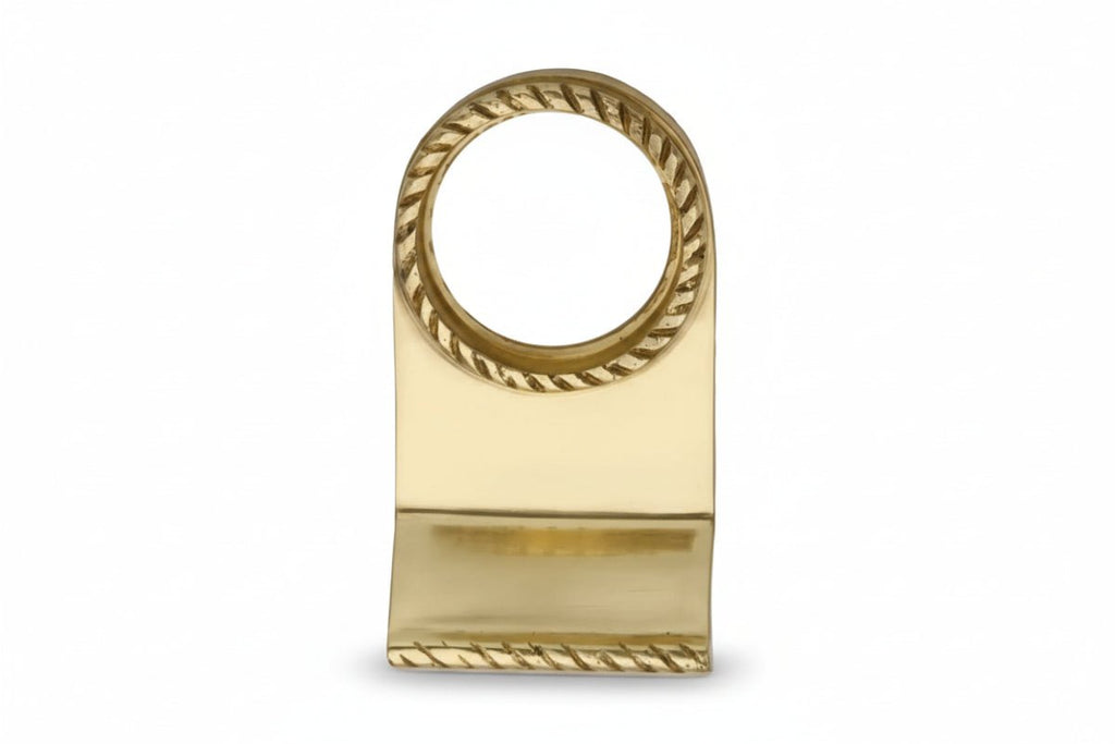 Gold napkin ring with decorative design on a white background