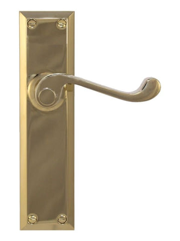 Brass door handle with rectangular plate on a white background