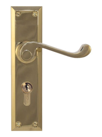 Brass door handle with lock on a white background