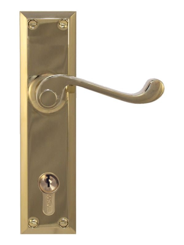 Brass door handle with lock on a white background