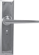 Chrome door handle on a metallic door with a white background