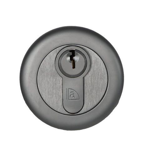 Round metallic lock with keyhole on a white background