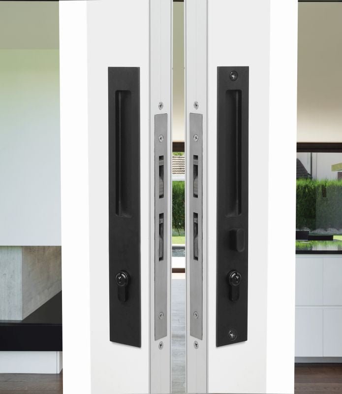 Modern sliding glass door with black handles and a white frame.