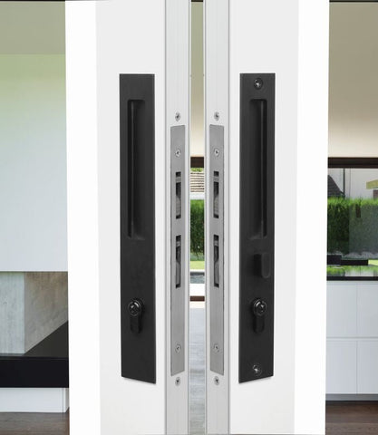 Modern sliding glass door with black handles and a white frame.