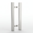 Stainless steel door handle on a dark background